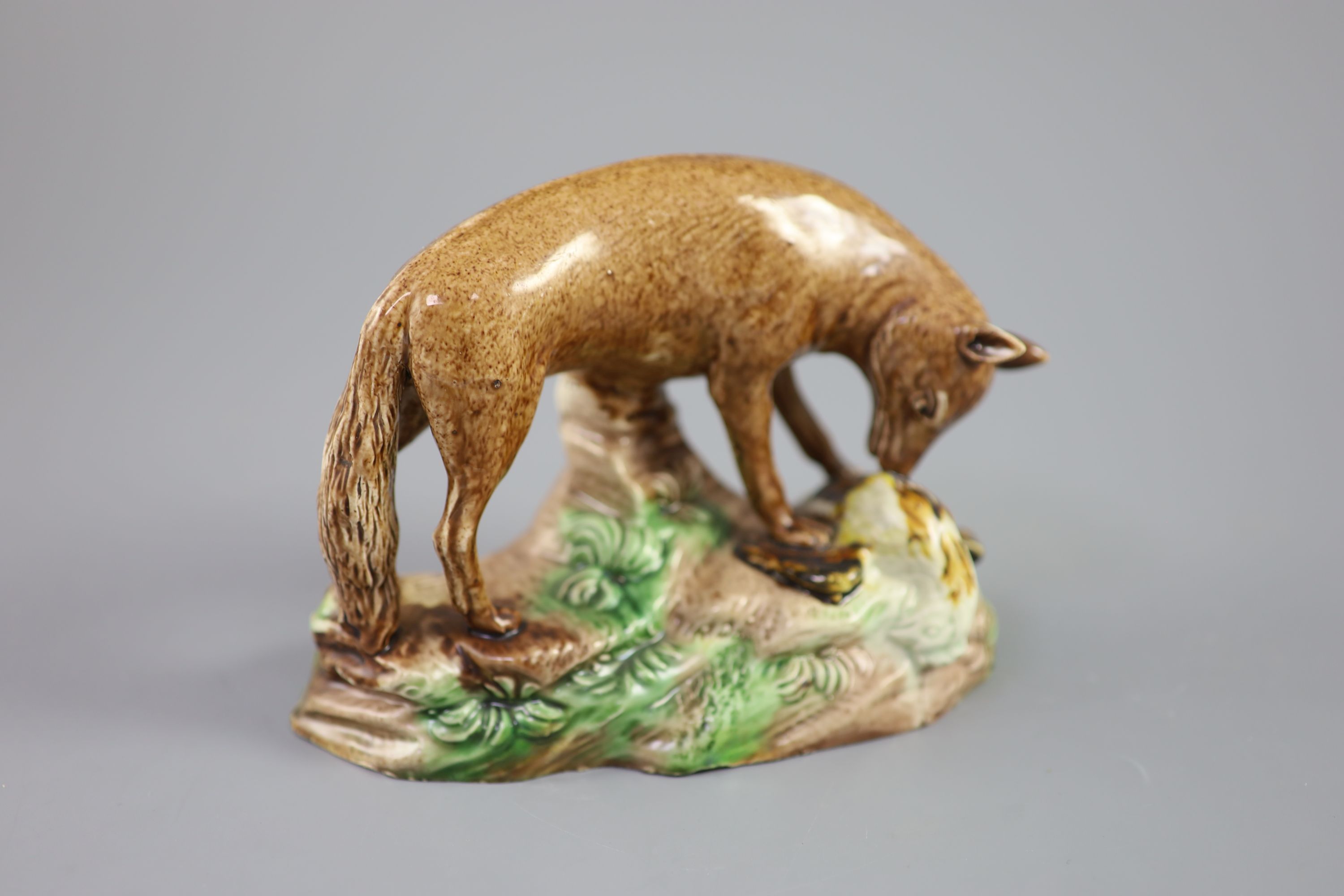 A Ralph Wood the Younger polychrome pottery figure of a fox with rooster, c.1780, 16.5cm long